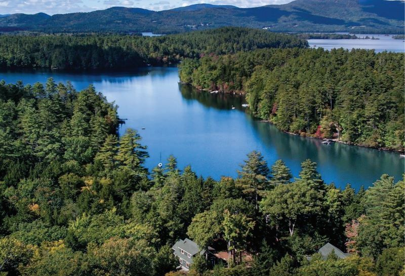 PRIVACY & TRANQUILITY ON SQUAM LAKE WITH DEEP-WATER FRONTAGE