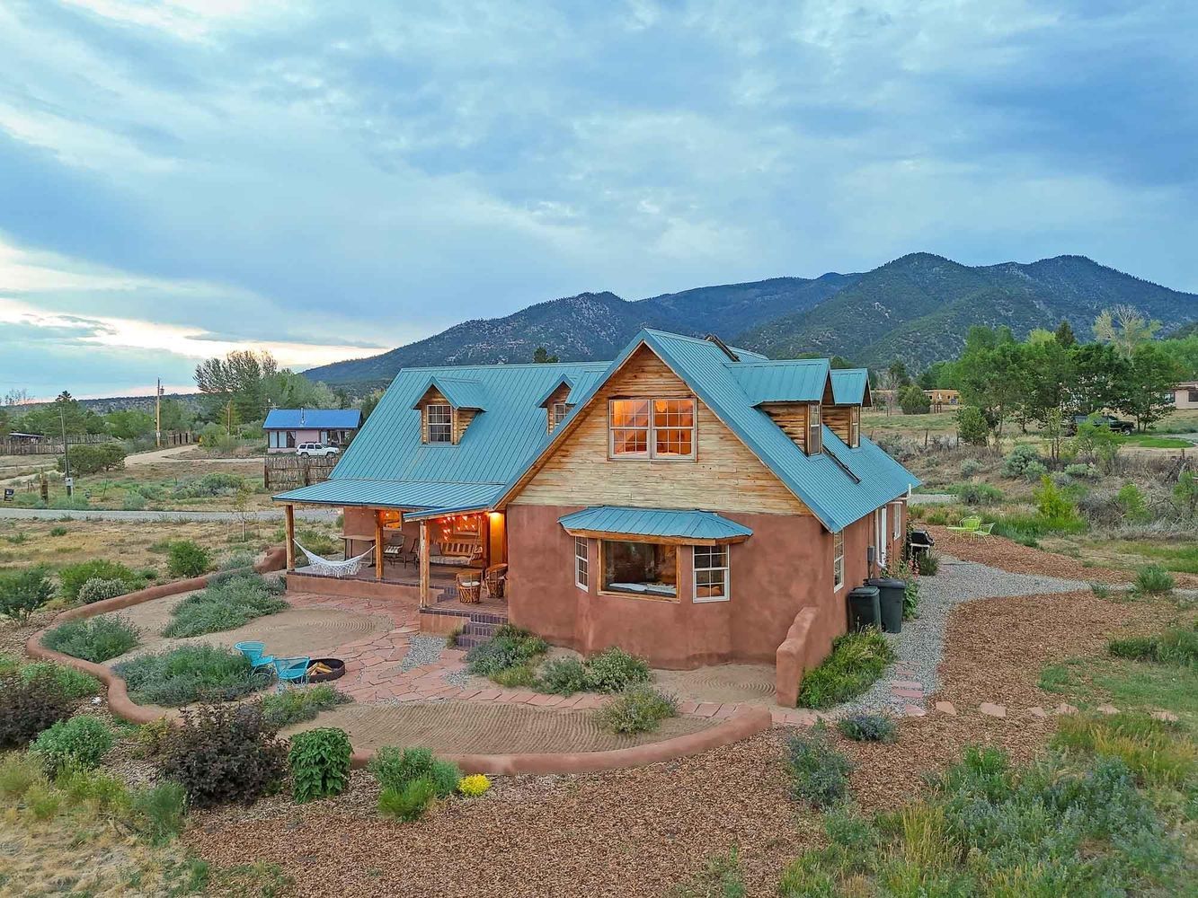 Adobe Living Beneath Mountain Skies