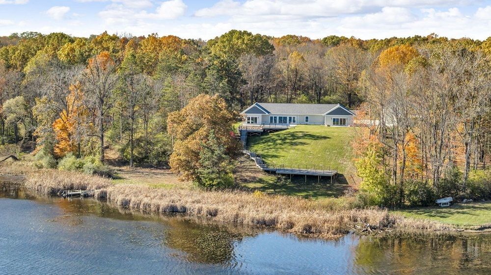 Breathtaking Views, Extraordinary Design, And 100 Feet Of Pristine Crispell Lake Frontage Define This Exceptional Waterfront Retreat.