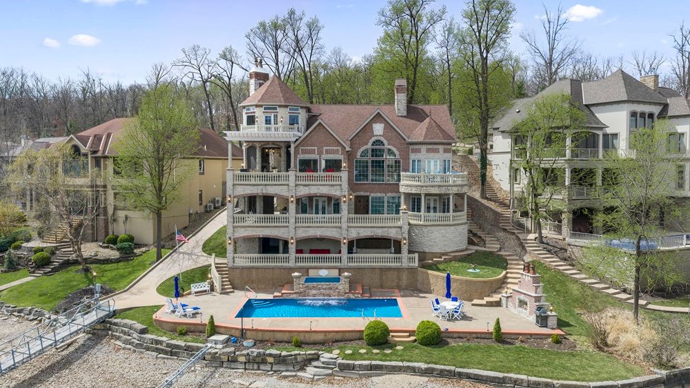 Breathtaking Views, Extraordinary Design, And 100 Feet Of Pristine Crispell Lake Frontage Define This Exceptional Waterfront Retreat.