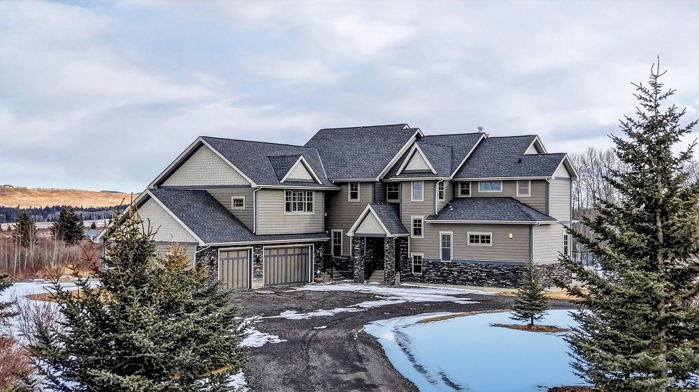 A Beautifully Designed Home Set A Mongst Stu N Ning For Ested Grou Nds W Ith M Atu R E Trees, Shrubs, And Open Meadows