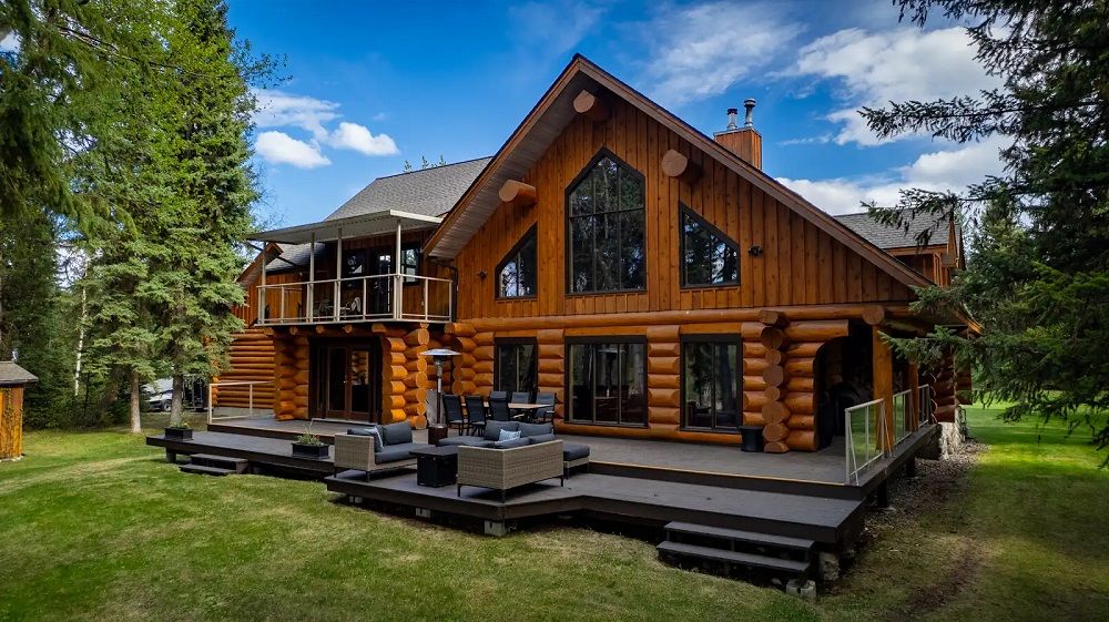 Timeless Log Home Craftsmanship With Prestigious Riverfront Living
